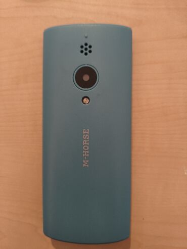 hard disk ssd: M-HORSE M3100 modeli, açıq mavi rəngdə klassik mobil telefondur. Bu