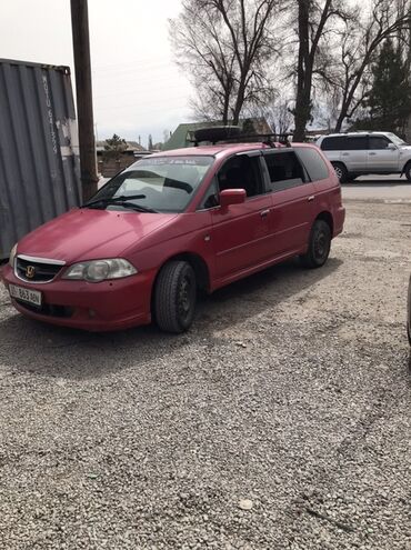 домкрат для машины цена: Автомобиль Honda Odyssey красного цвета с рейлингами на крыше, что