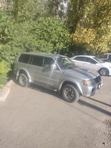 Mitsubishi: Mitsubishi Pajero Sport (I поколение), серебристый внедорожник