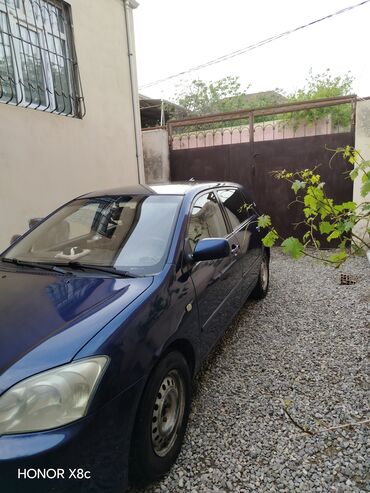 Toyota: Toyota Corolla: 1.4 l | 2004 il Sedan — 1
