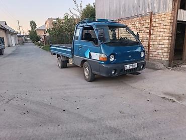 запаска шин: Hyundai Porter (портёр) — малотоннажный бортовой грузовик - Кузов — 1