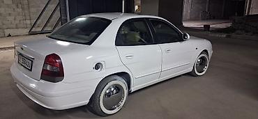предлогайте варианты: Daewoo Nubira: 2000 г., 1.5 л, Механика, Бензин, Седан — 7