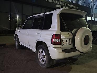 эвакуатор озгон: Mitsubishi Pajero iO: 2003 г., 2 л, Автомат, Бензин, Жол тандабас — 1