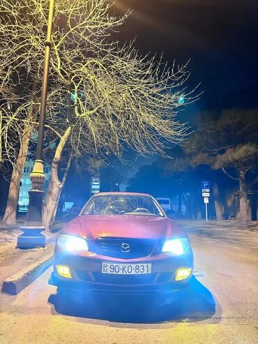 Mazda Millenia: 2.5 л | 2002 г. Седан