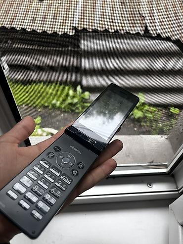 Другие мобильные телефоны: Два телефона. 1) Кнопочный раскладной телефон NTT Docomo (японская — 5
