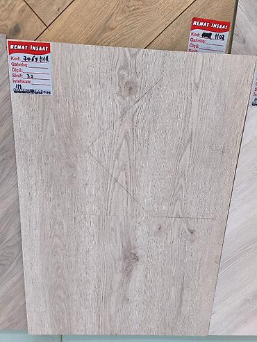 Laminat döşəmə – açıq boz/meşə teksturalı dekor - Brend: Renat İnşaat