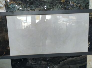 gence kafel metlax: Açıq rəngli, hamar səthli, dördbucaqlı keramika plitəsi. Mərmər