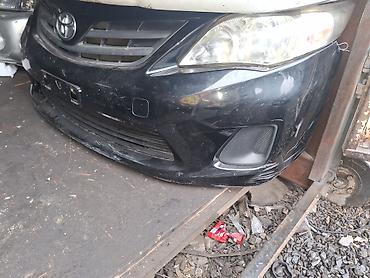Передний бампер для Toyota Corolla (E150 дорестайлинг/рестайлинг —