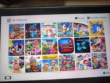 Nintendo Switch: 🔥 JEDINSTVENA PONUDA! Prodajem Nintendo Switch 32GB + microSD 400GB — 9