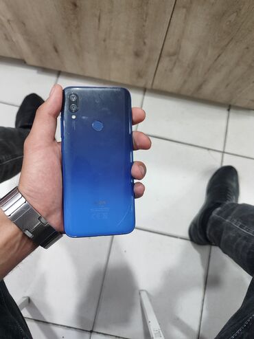 telefon fly bl9104: Xiaomi Redmi 7, 64 ГБ, цвет - Синий, 
 Кнопочный, Отпечаток пальца, Face ID