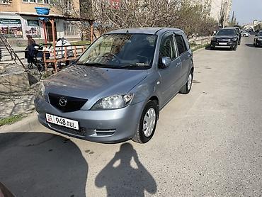 е 210: Mazda Demio: 2004 г., Автомат, Бензин, Хэтчбэк — 1