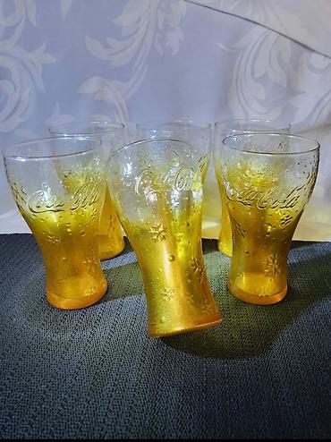 Čaše: Case nove Coca Cola. Case nove,sve na njima odsjaj od — 2