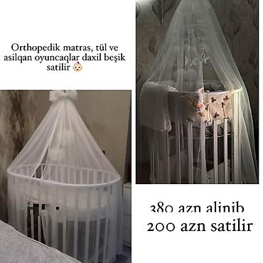Beşiklər: Ağ rəngli dairəvi uşaq beşiyi. Komplekt: - Ortopedik matras - Tül — 1