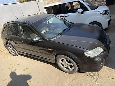 мустанг авто: Mazda 323: 2001 г., 2 л, Автомат, Газ, Универсал — 6