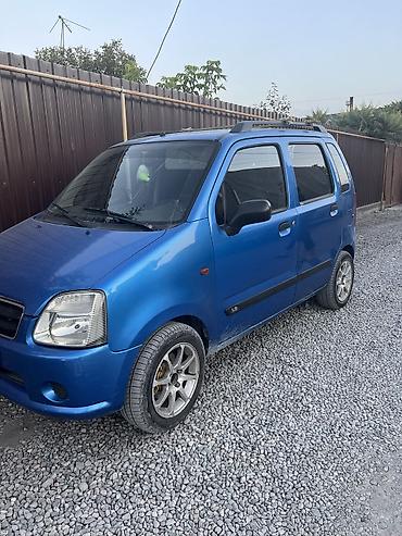 Microcar: Компактный городской хэтчбек/минивэн синего цвета. Основные — 2