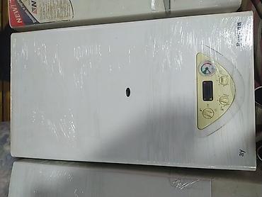 islemis soyuducu: Divar tipli qaz kombisi - Ön paneldə analoq manometr (sistem təzyiqi — 1