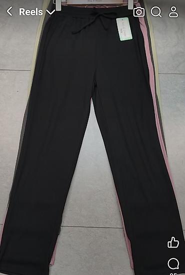 pantalone sat: Pantalone sa dzepovima i elasticnim pojasem na redice. Puder — 4