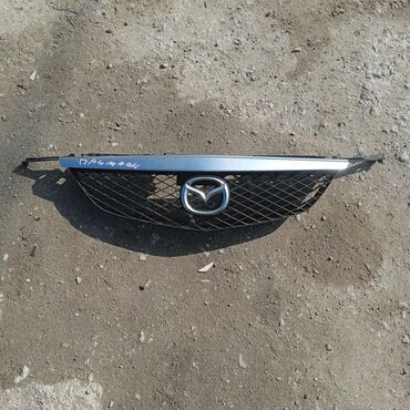 Решетки радиатора: Решетка радиатора Mazda Б/у — 27