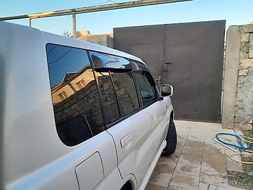 Mitsubishi: Mitsubishi Pajero IO (ağ rəng) – kompakt, çevik və tam ötürücülü — 4