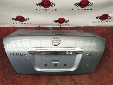 Бамперы и комплектующие: Крышка багажника Nissan