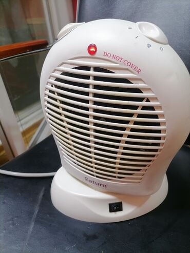 Kaloriferi: Grejalica duvaljka 2 brzine plus ventilator Saturn 2000w Okreće pri — 11