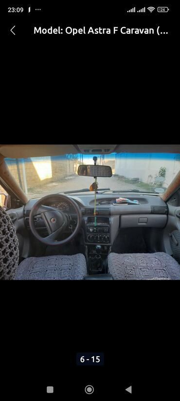 Opel: Opel Astra Caravan – universal kuzovlu, qara rəngdə. Əsas — 8