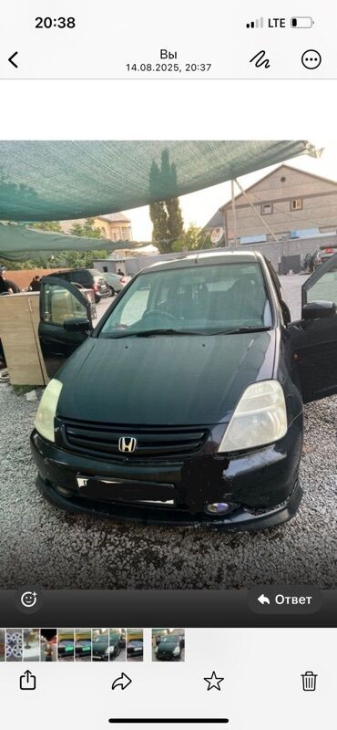 домик на колесо: Черный минивэн Honda Stream с характерным дизайном кузова. Автомобиль