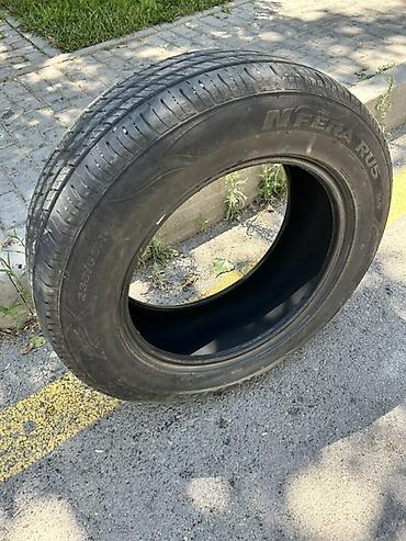 disk teker type 1 per page 40: Avtomobil üçün şin satılır. Şinin ölçüsü **235/65 R18**-dir. Yan — 2