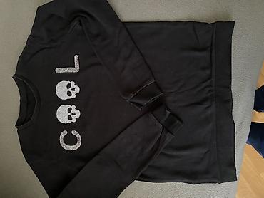 Kişi geyimləri: Qara sweatshirt – “COOL” yazılı, hərfdə kəllə sümüyü motivləri ilə.10 — 2