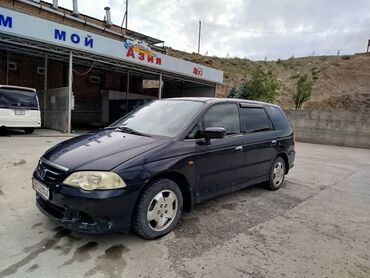 Honda: Минивэн Honda Odyssey в черном цвете. Удобный семейный автомобиль с