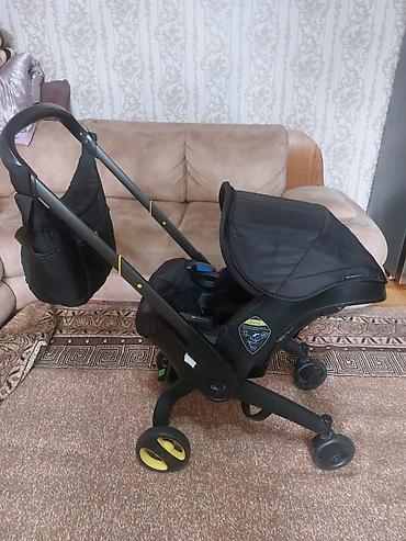 Kolyaska 2 si birinde 100 azn hem de avtokreslo olur Cantasi ic