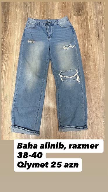 Cinslər: Model: Geniş kəsimli mavi cins şalvar - Stil: yırtıq və aşınma — 1