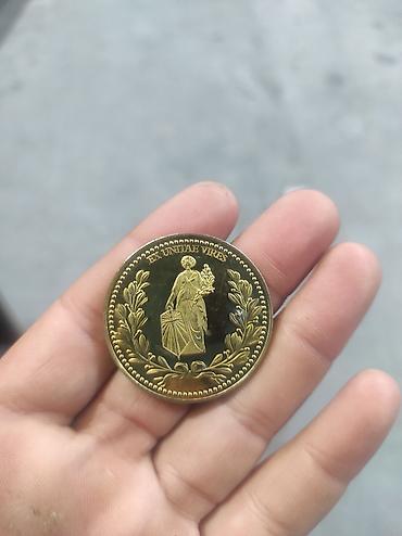 gerb səkilləri yuklə: Johnwik. filminden Qızılı rəngli kolleksiya medal/koliye – “ENS CAUSA — 2