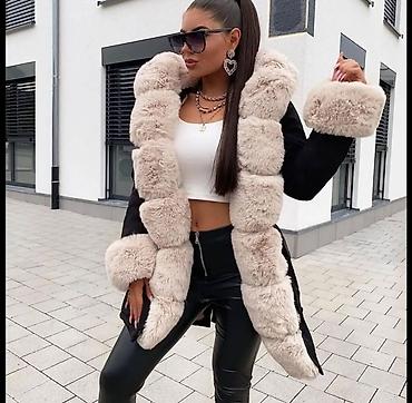 rukavice elegantne: Elegantna ženska zimska jakna sa bogatim krznenim detaljima. Model — 2