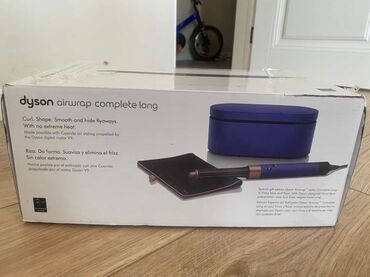 вокальный процессор: Стайлер для волос Dyson в синем и розовом цвете. Поставляется в