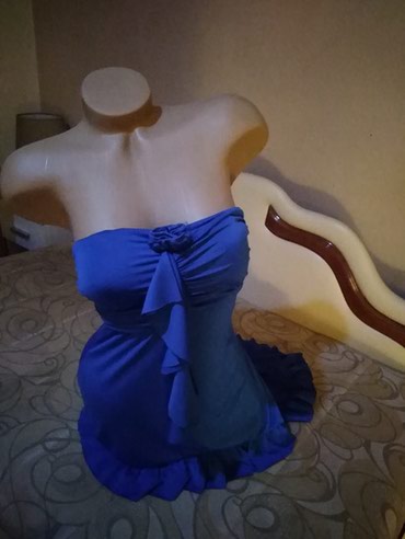 Plava asimetricna haljina sa karnerom .M vel.Napred  kraca nazad duza