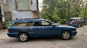 электромобиль neta: Универсал Mitsubishi Legnum синего цвета, оснащенный багажником на