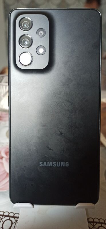 zaryatka yigan aparat: Samsung Galaxy A53 5G, 128 GB, rəng - Qara, Barmaq izi, İki sim kartlı, Face ID