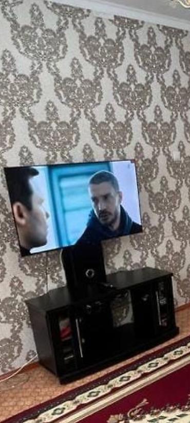 потставка под телевизор: Тумба под телевизор в современном стиле. Модель выполнена в чёрном — 1