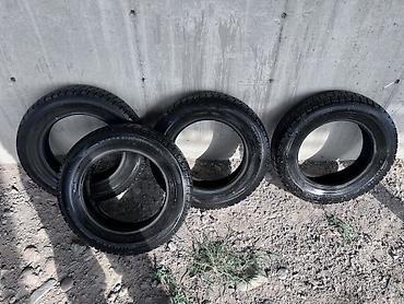 Комплект из 4 зимних шин Dunlop. Характеристики: - Размер: 185/70 R14