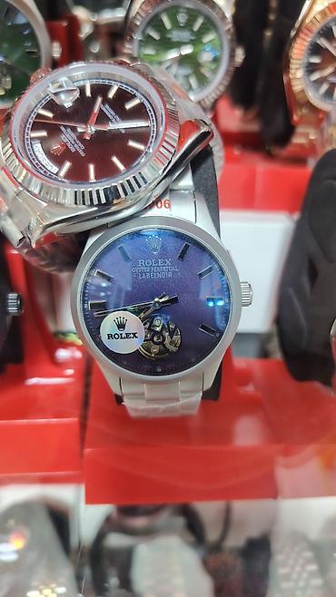bakida saat: Saat: “Rolex Oyster Perpetual LabelNoir” üslubunda mexaniki qol saatı — 2