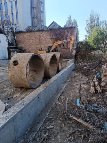 водоотводный лоток: Бетонные кольца для строительства колодцев или канализационных систем