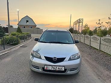 мата секыл: Mazda 2: 2003 г., 1.3 л, Кол менен иштөөчү, Бензин, Хетчбек — 1