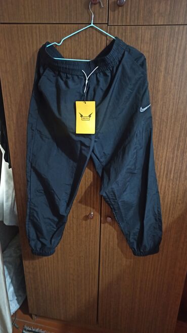 размеры мужской спортивной одежды: Брюки Nike, 2XL (EU 44), цвет - Черный