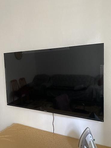 ТВ и видео: LED-телевизор VONIN, диагональ примерно 55–60". Тонкая рамка, черный — 1