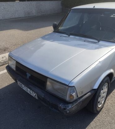 Tofas: Tofaş Şahin/Doğan (sedan) – gümüşü rəng Xüsusiyyətlər: - Kuzov: 4 — 4