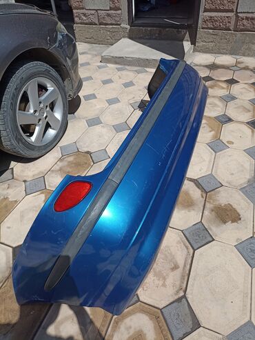 Бамперы: Задний Бампер Nissan 2002 г., Новый, цвет - Синий, Оригинал
