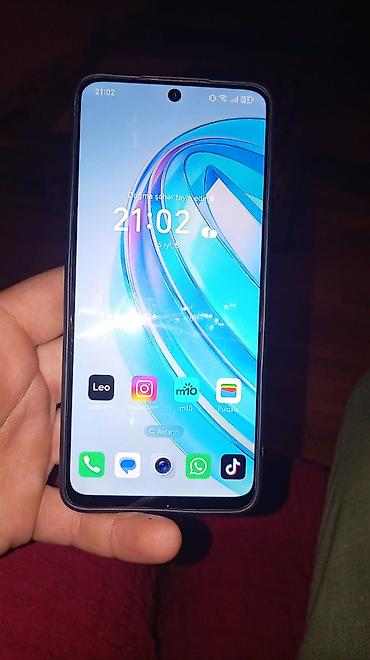 iphone promax 1: Smartfon – böyük ekranlı, mərkəzi “punch‑hole” ön kamera dizaynı ilə — 2