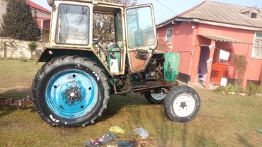 Traktorlar: YUMZ traktor – böyük kabinalı model Xüsusiyyətlər: - Dizel mühərrik — 1
