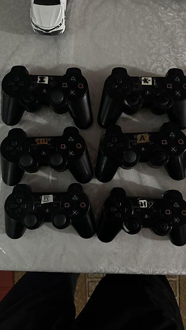 джойстики dualshock: Геймпады Sony PlayStation 3 (DualShock 3/SIXAXIS), черные. - — 1